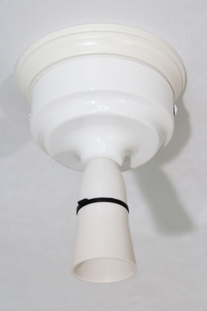 ceiling light fixture in white with wooden mounting block