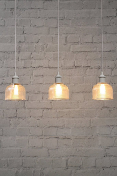 pendant light with white cords and ceiling rose