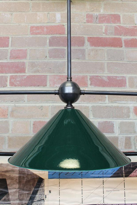 3 light pendant with large cone shades in green enamel finish has are subtle and simple while still commanding attention in any decor.