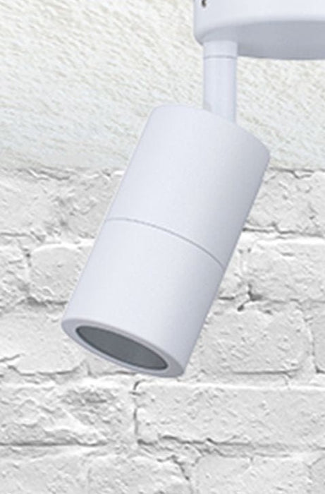Close up of twinlight spotlight in white affixed on a brick wall.