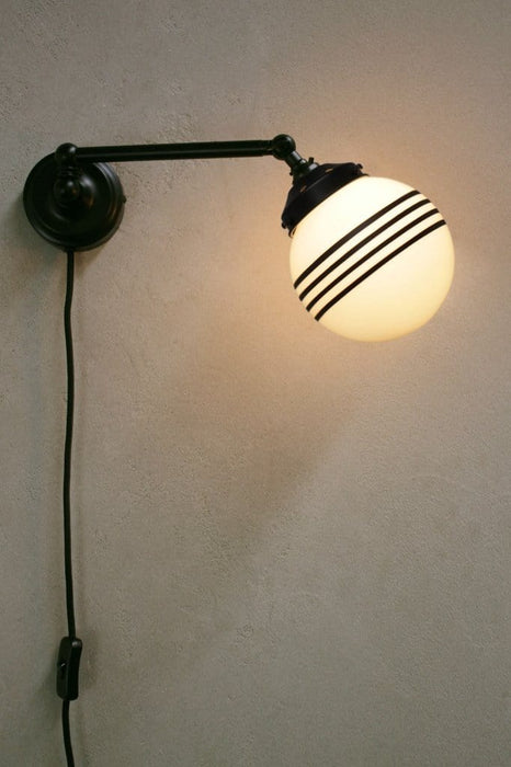 Plug in wall light with small opal four stripe shade