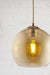 Amber glass pendant light with antique brass cord