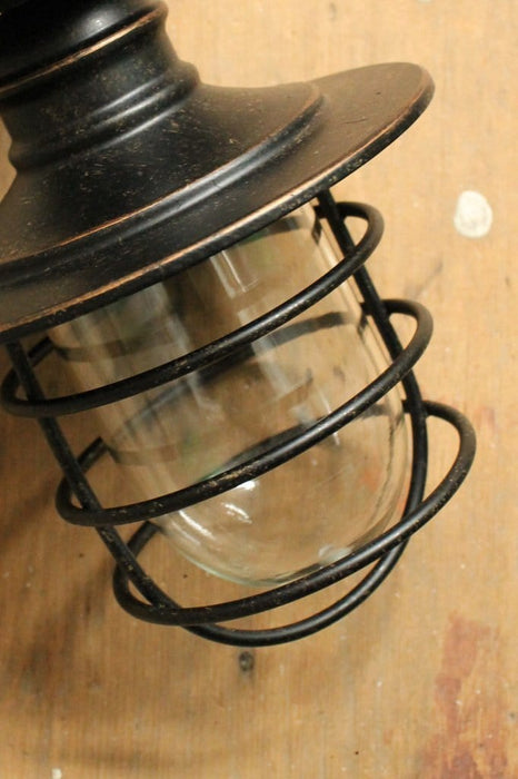 Antique bronze cage light. industrial warehouse style light. buy pendant lights online.