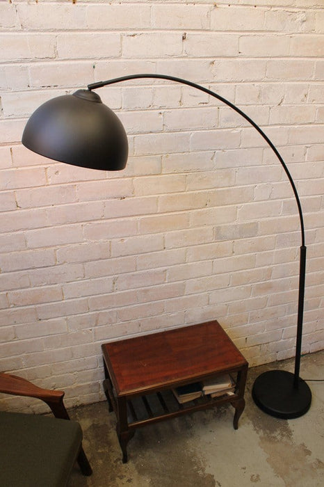 Arc floor lamp styled after achille castiglioni