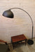 Arc floor lamp styled after achille castiglioni
