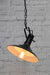 Tiltable pendant light with black enamelled shade