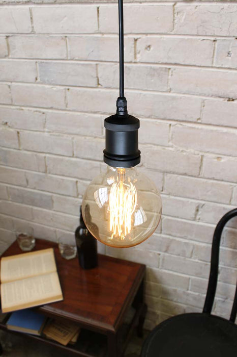 Bare bulb pendant light with black cord