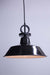 Pendant light with black shade and cord with disc