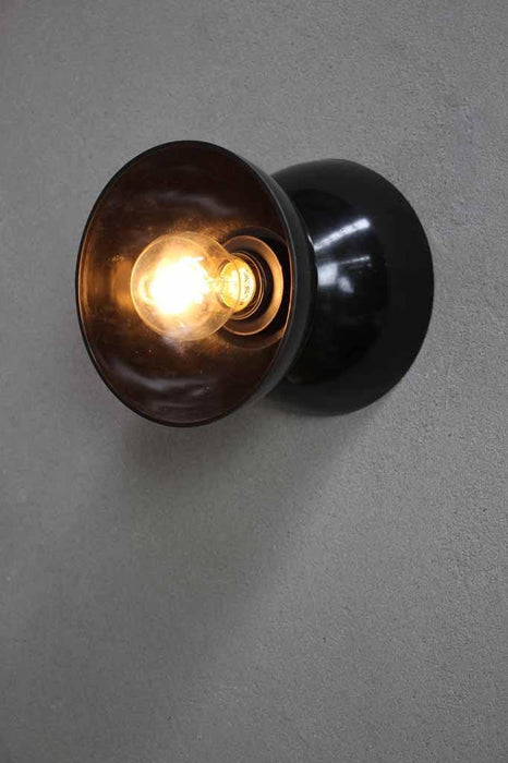 Bakelite wall light with black shade and base