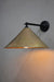 Black steel wall arm with large aged brass shade