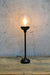 Black steel candlestick lamp with clear shade