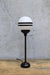 Black steel candlestick lamp with opal two stripe shade