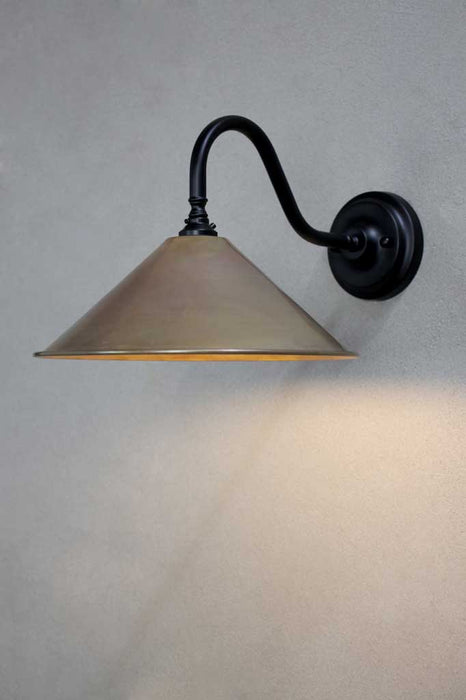 Black steel sconce with aged brass shade