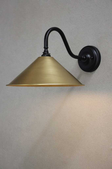 Black steel sconce with bright brass shade