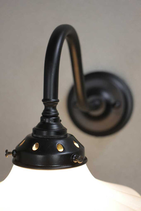 Black steel sconce with opal shade