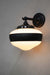 Black wall light with small opal one stripe shade