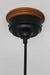 Black metal ceiling rose with wooden block on ceiling for pendant cord