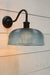 Large blue holophane glass wall light with black sconce