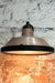 Aged brass wall light with frosted cover