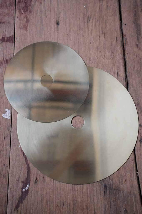 Small and large brass discs