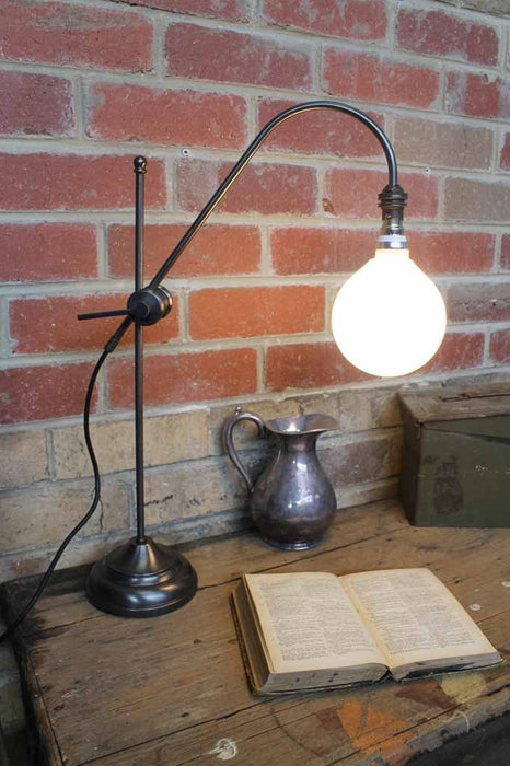 Brass table lamp adjustable curved arm with bright light bulb