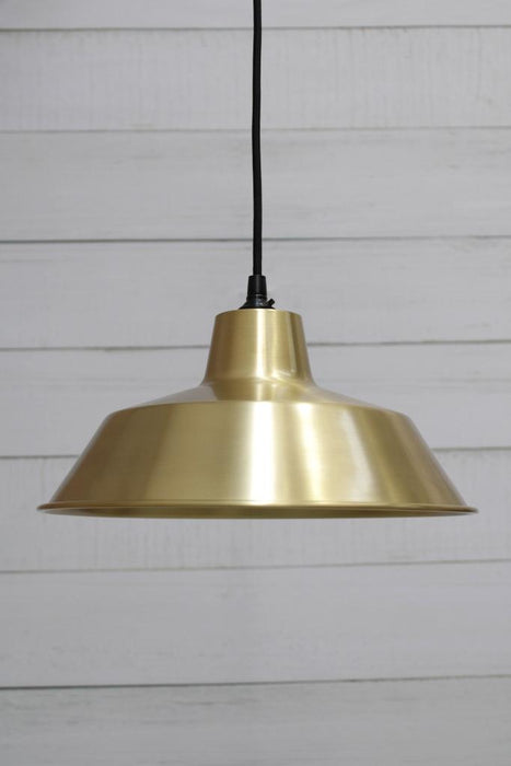 Bright brass pendant light with round black cord