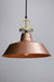 Bright copper pendant light with gold cord and disc