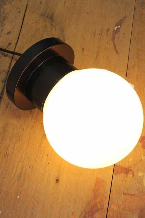 Bunker globe light has a opal glass ball cover