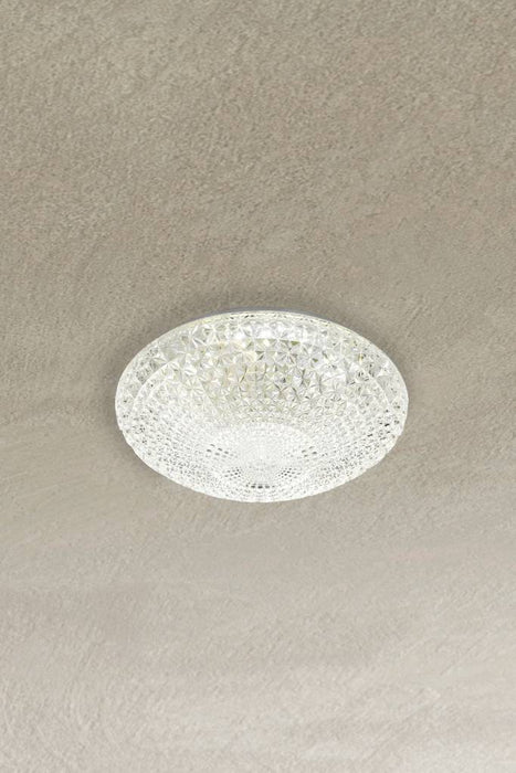 Small variant of flush mount light affixed on ceiling