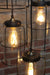 Cage jar pendant light made of glass and black cage with led bulbs