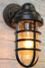 Canal outdoor wall light with a cage shade