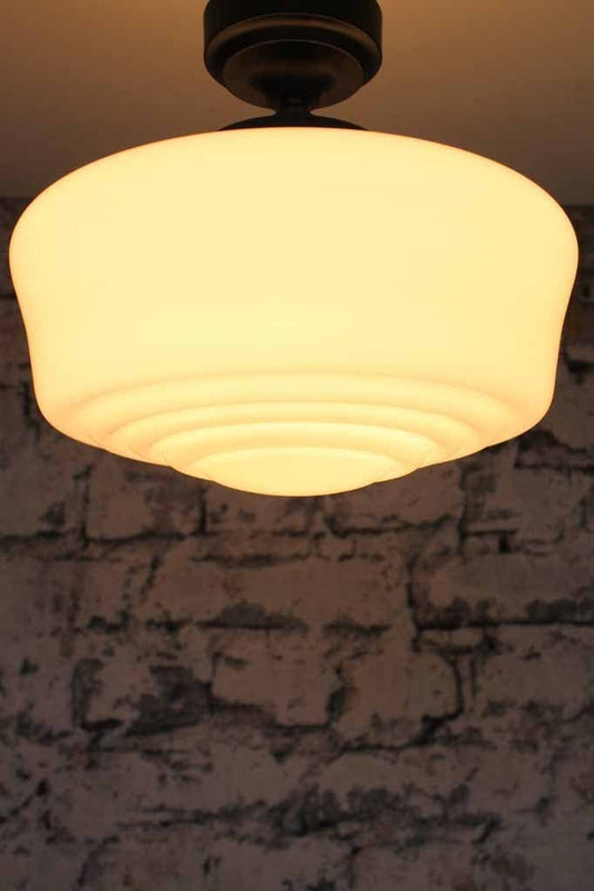 Carlyle hand blown shade with light on perfect for low ceilings in any traditional home or vintae styled room or class interior design