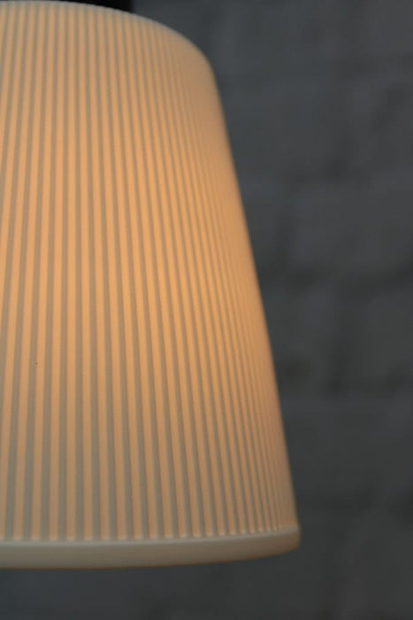 Close-up of pleat detailing on ceramic shade