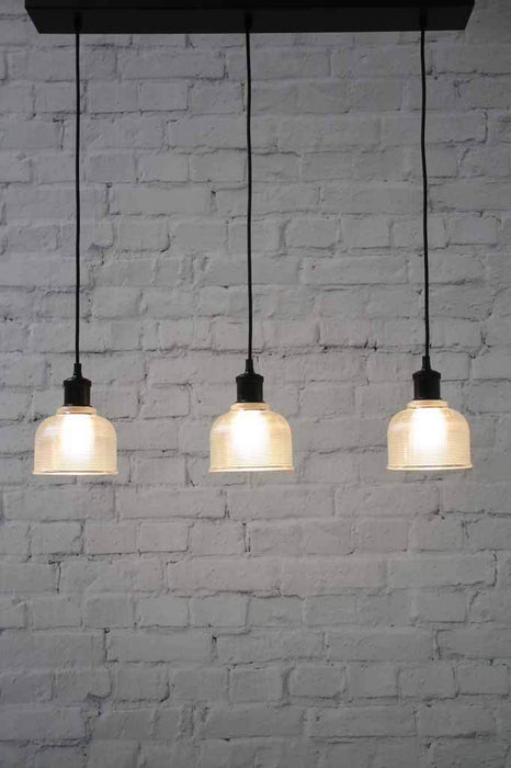 Chapman vintage style glass shade. black pendant cord lights. hanging kitchen bench lights