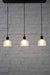 Chapman vintage style glass shade. black pendant cord lights. hanging kitchen bench lights