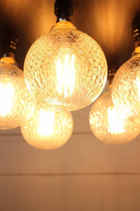 Close up of crystal opal glass shade with vintage classic bulb design