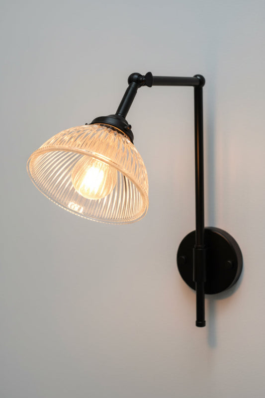 Black wall light with holophane glass shade