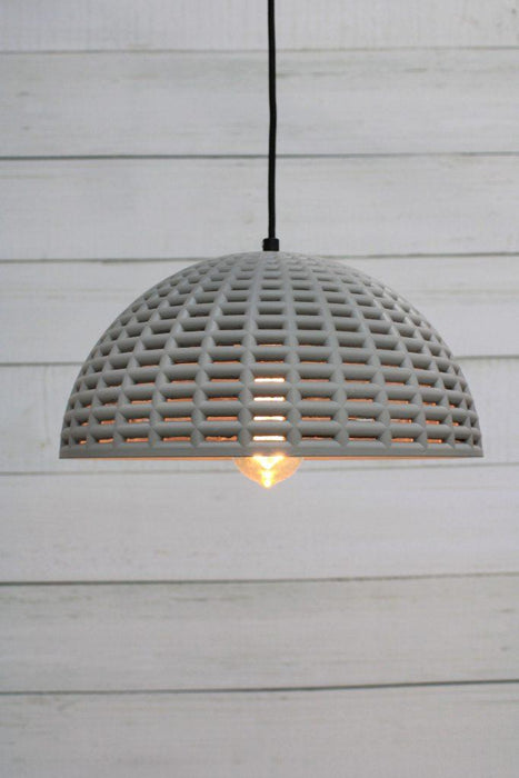 Concrete pendant light with vintage bulb