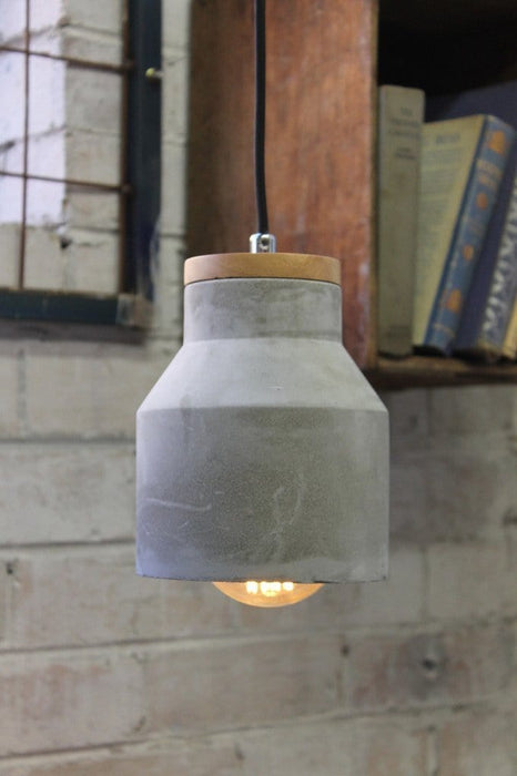 Concrete timber pendant with exposed bulb