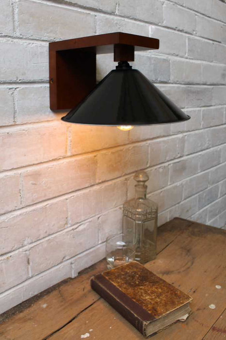 black cone shade with a wood wall sconce
