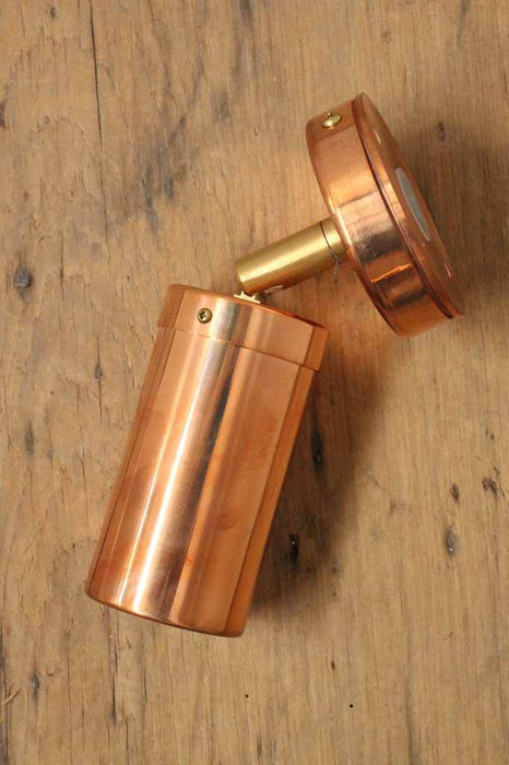 Copper outdoor light. single directional spotlight. polished copper finish.