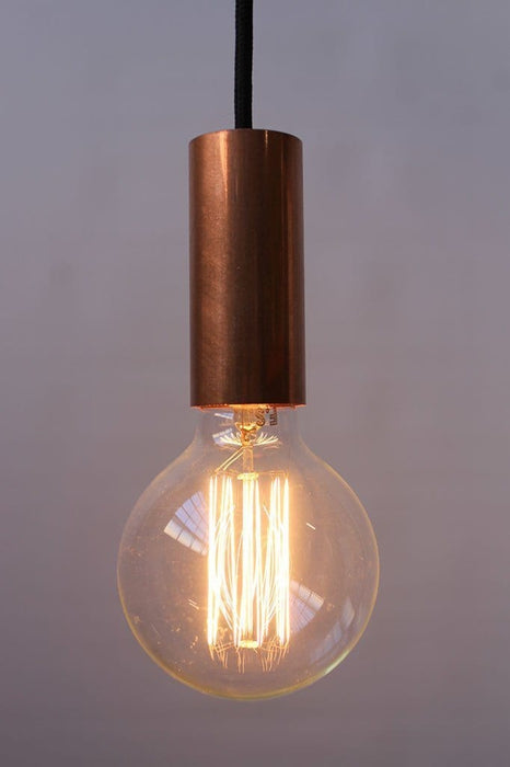Copper pipe pendant with large round edison bulb