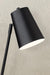 Close up of Black table lamp shade with a textured background