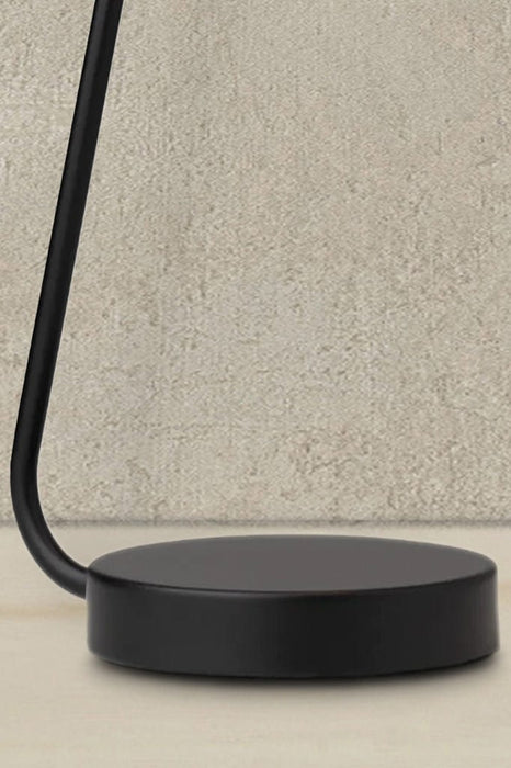 Close of black table lamp base with a textured base