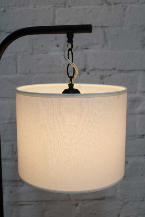 Black floor lamp with white fabric shade