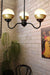 Crown Upright Gooseneck Chandelier with black gallery with a gold and opal shade