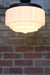 Deco glass close to ceiling light has large milky glass shade and is art deco style lighting