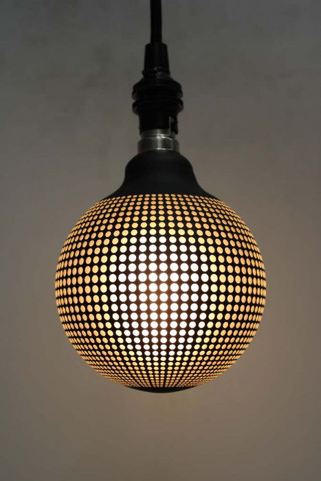 Light bulb with textured dot pattern on pendant cord