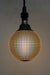Light bulb with textured dot pattern on pendant cord