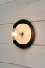 Large black with small white disc wall light